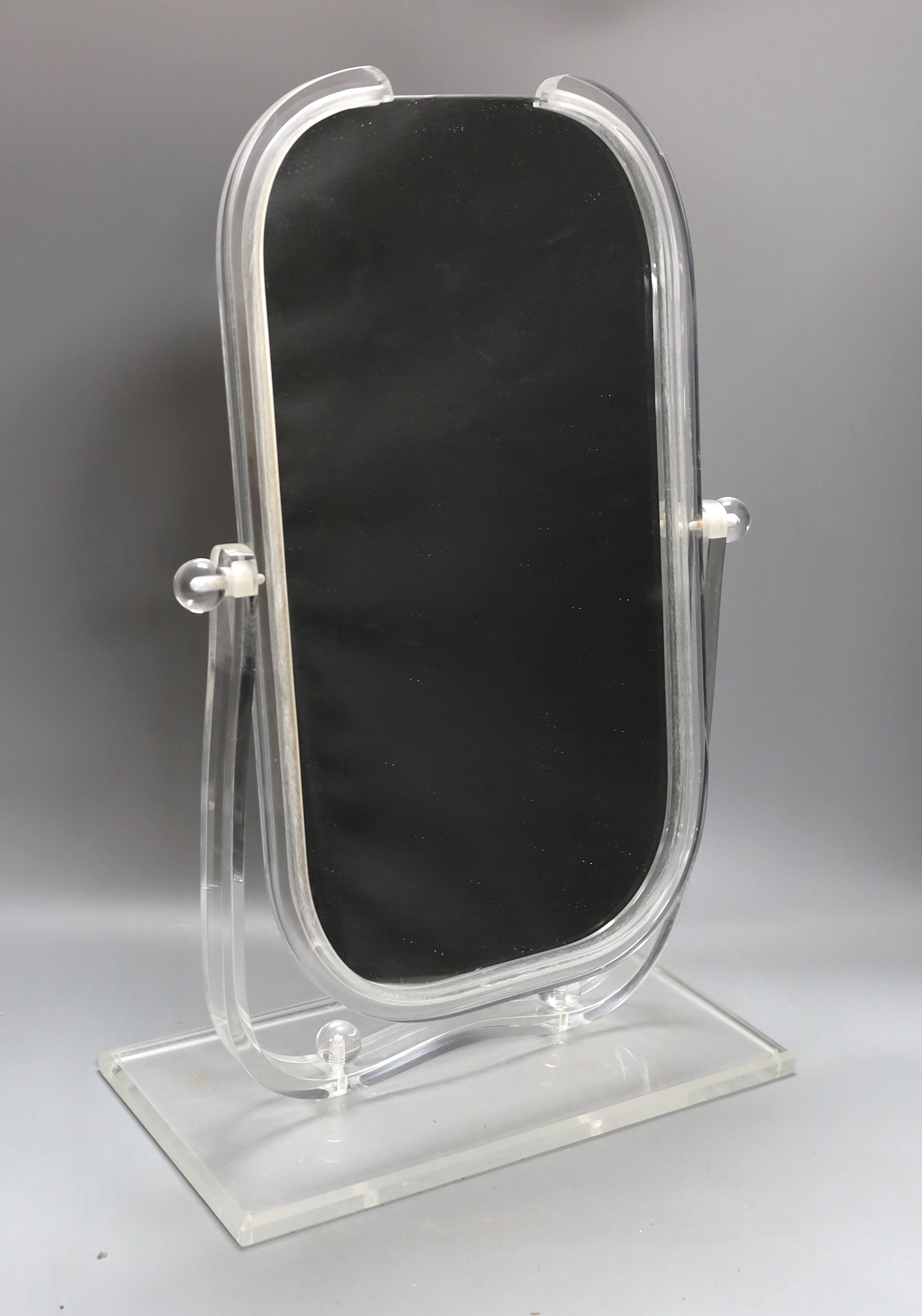 An American Art Deco lucite dressing mirror - 55cm tall
